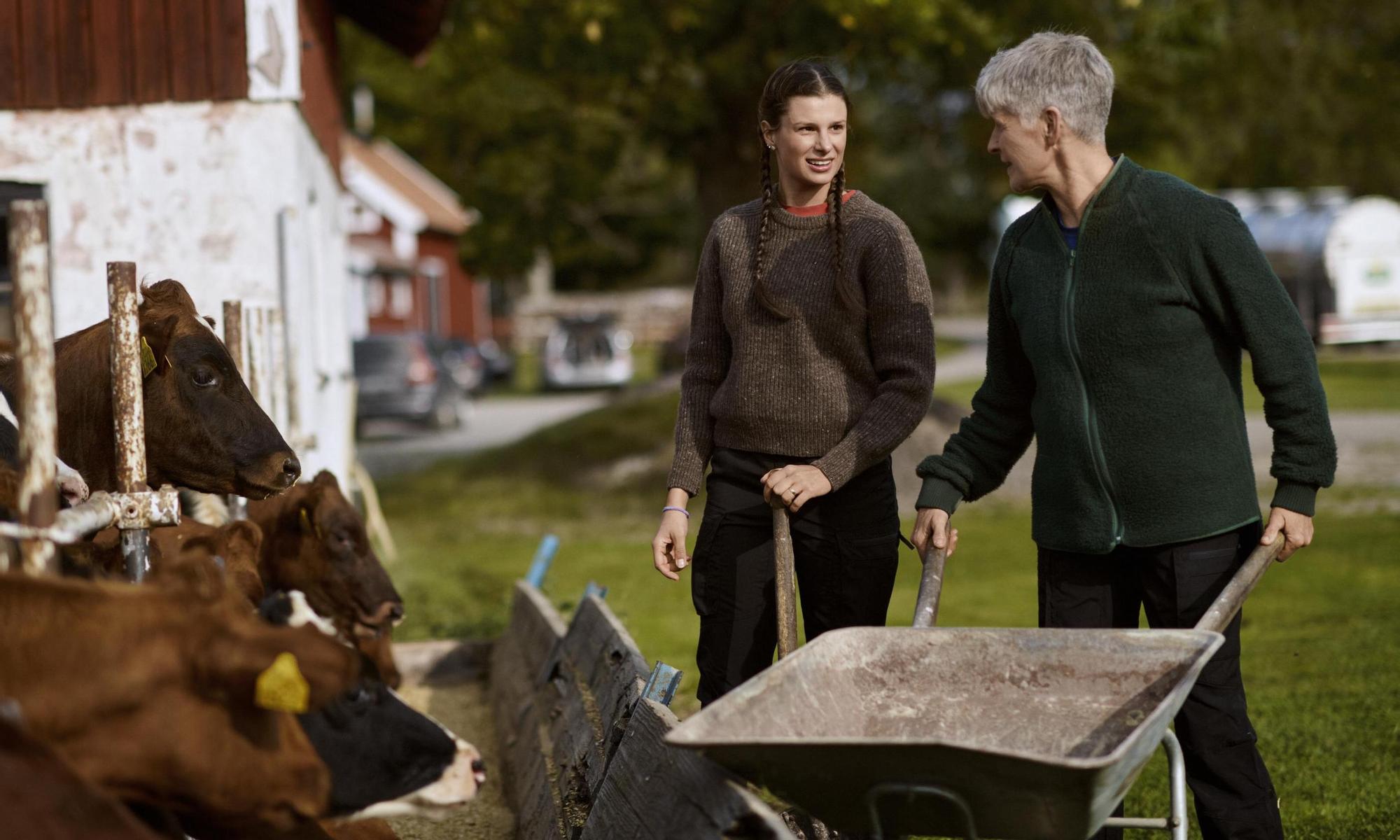 Two female farmers working at the farm